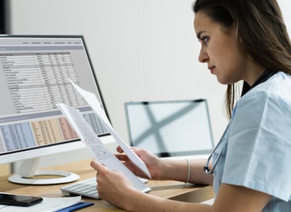 Medical billing and coding professional at work on computer